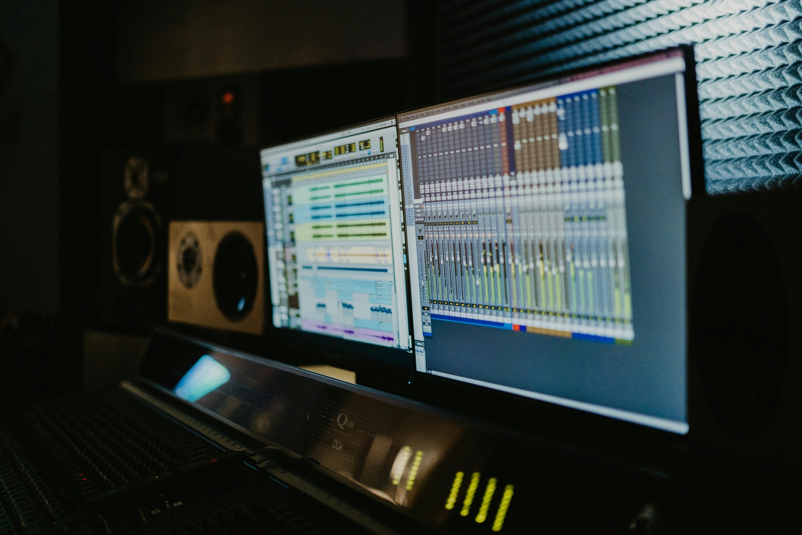 Sound designer at a workstation building a custom restaurant soundtrack